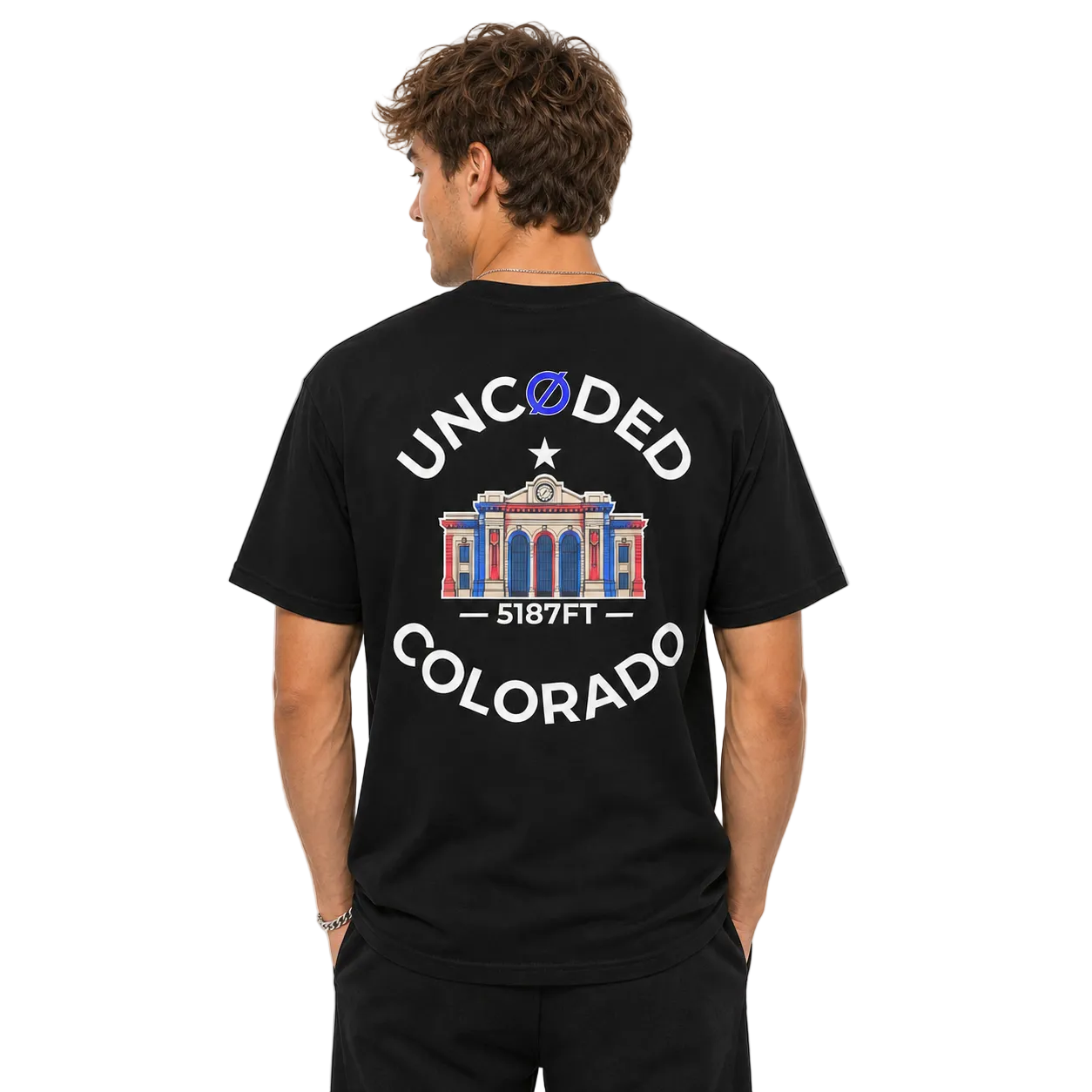Model wearing UNCØDED 5187 Station Tee black Colorado graphic tee back design