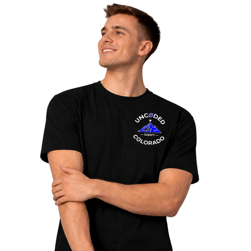 Model wearing UNCØDED 5280 Roots Tee black Colorado graphic tee front view