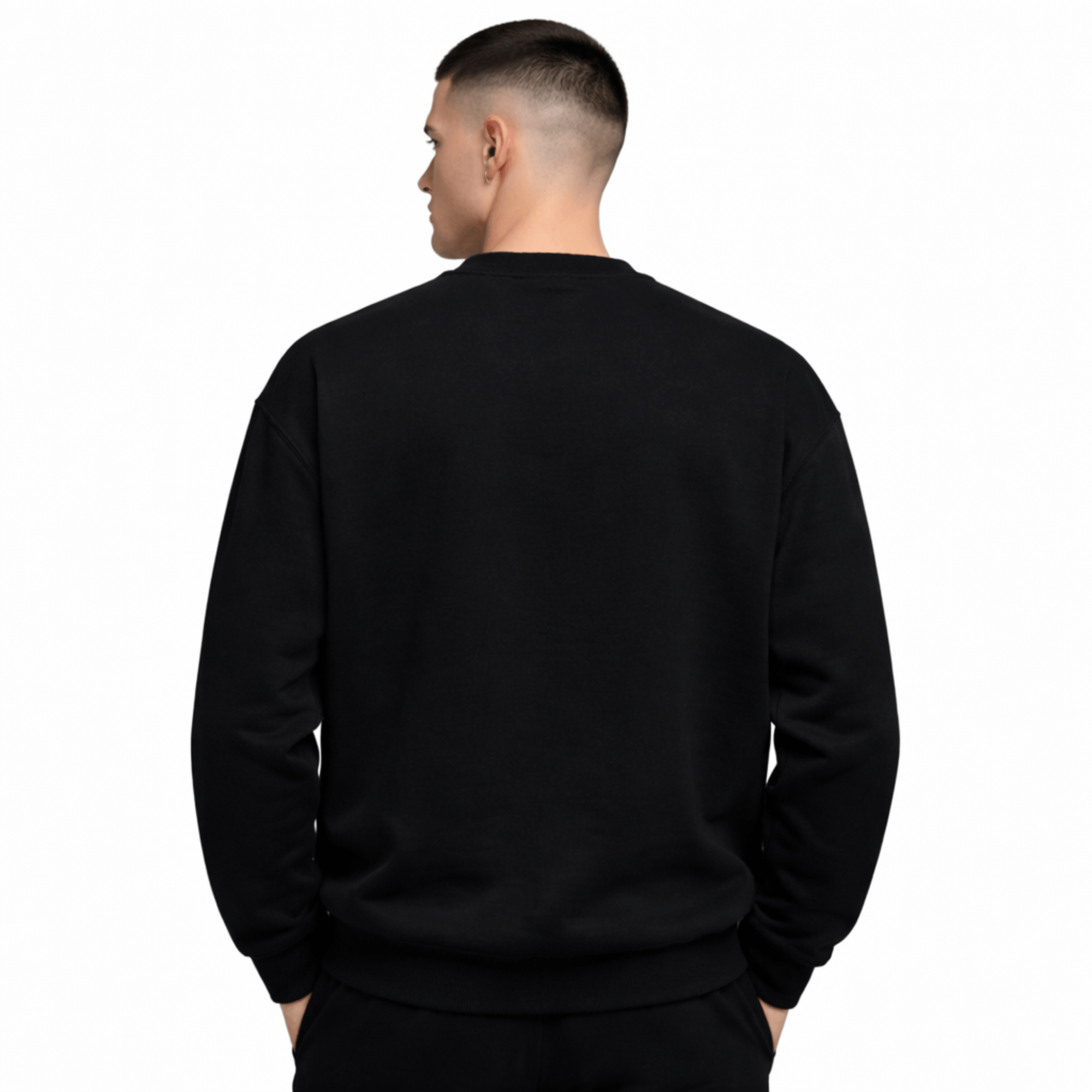 Model wearing UNCØDED Signature Sweatshirt black minimal streetwear crewneck back view #group:black